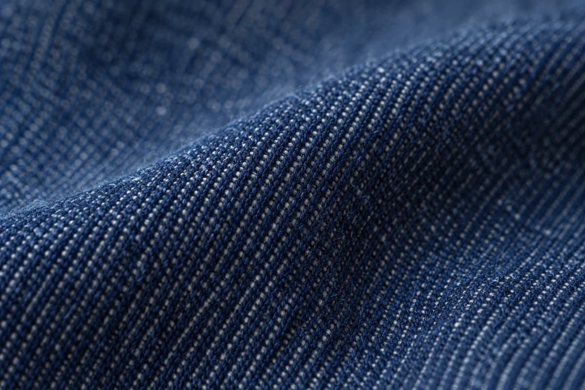 ภาพประกอบเนื้อผ้า Jeans (ผ้ายีนส์ เดนิม) ที่ใช้ผลิตหมวก ซูมใกล้