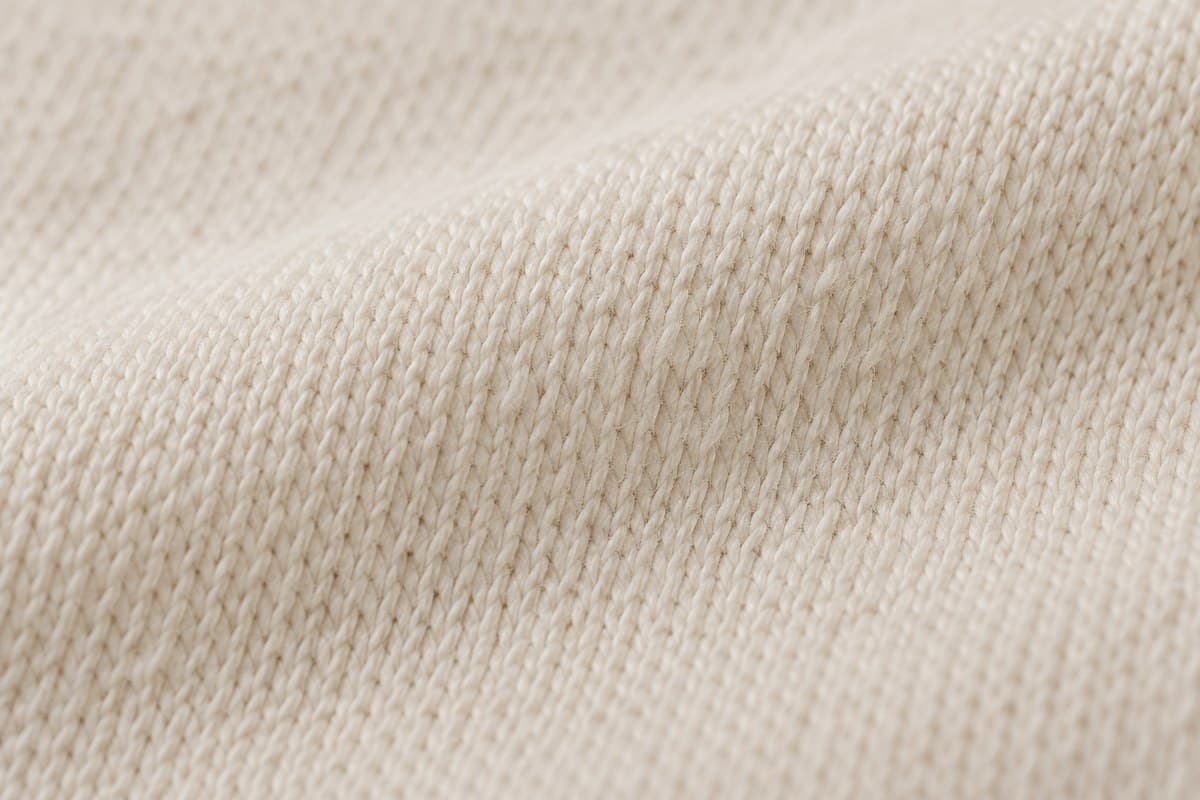 ภาพประกอบผ้า Cotton Nano Plus (ผ้าคอตตอน 100%) ซูมใกล้ให้เห็นลายถักของผ้ายืด