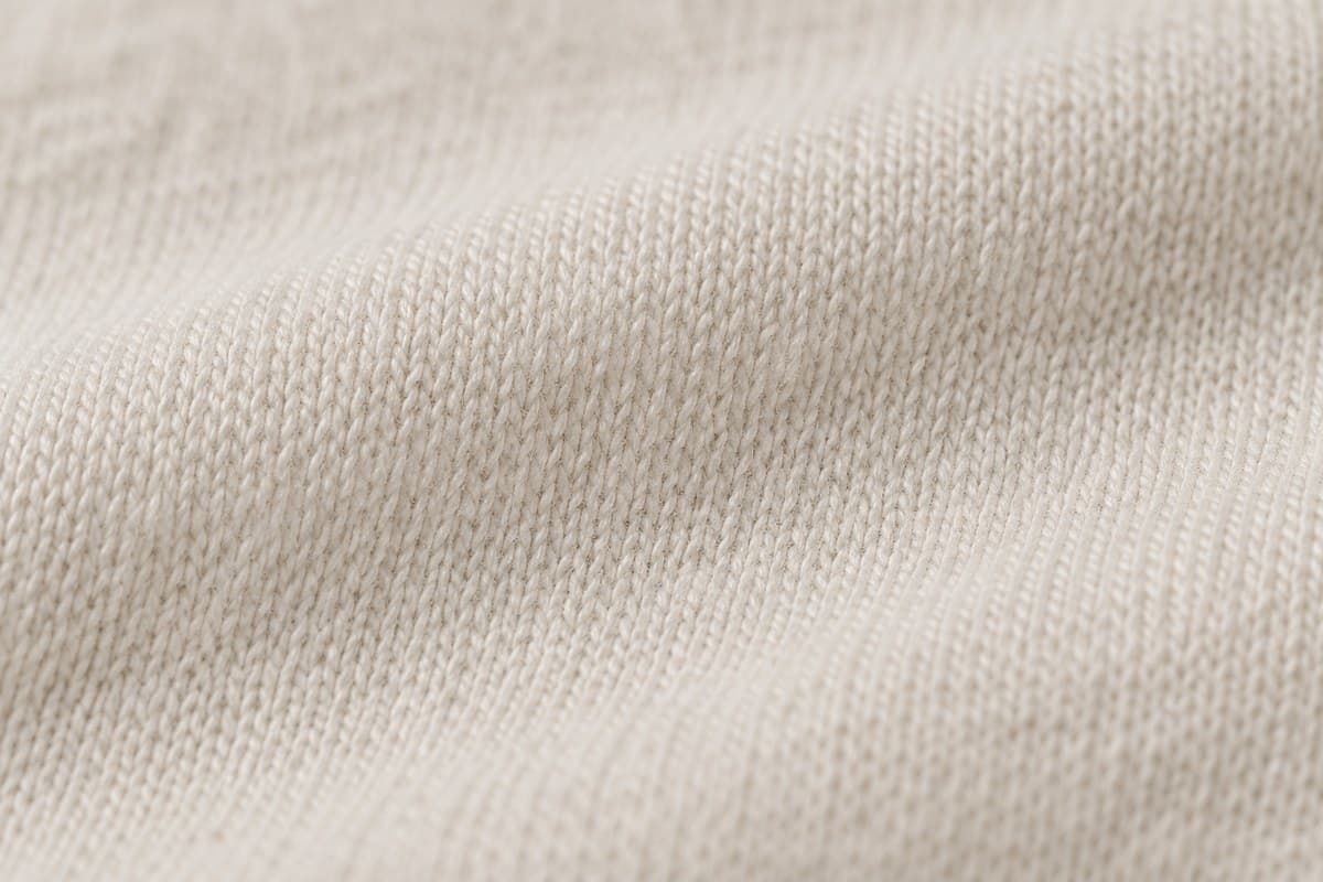 ภาพประกอบผ้า Cotton Nano (ผ้าคอตตอน 100%) ซูมใกล้ให้เห็นลายถักของผ้ายืด