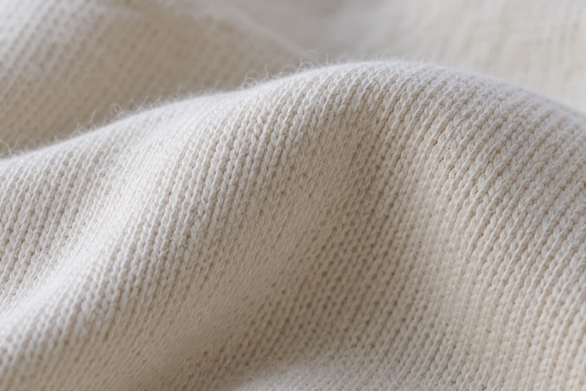 ภาพประกอบผ้า Cotton Shape (ผ้าคอตตอน 100%) ซูมใกล้ให้เห็นลายถักของผ้ายืด