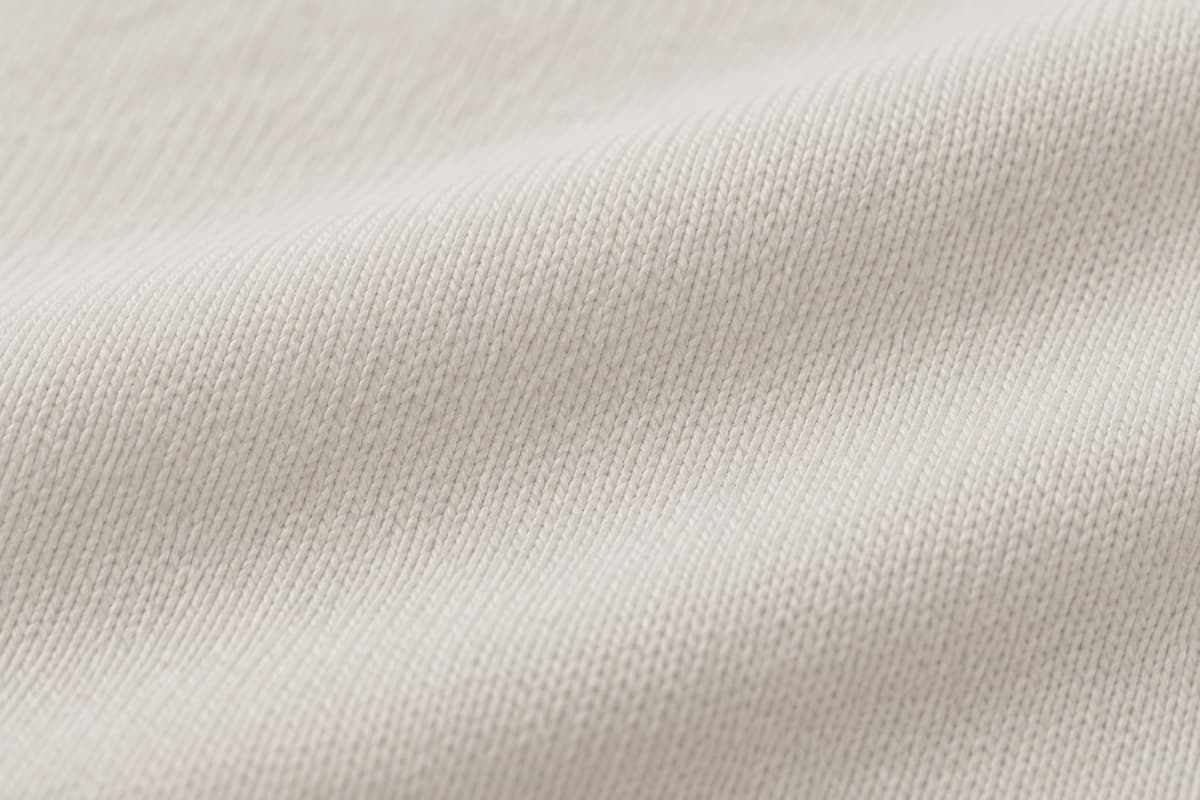 ภาพประกอบผ้า Double Soft Feel (ผ้าคอตตอน 100%) ซูมใกล้ให้เห็นลายถักของผ้ายืด