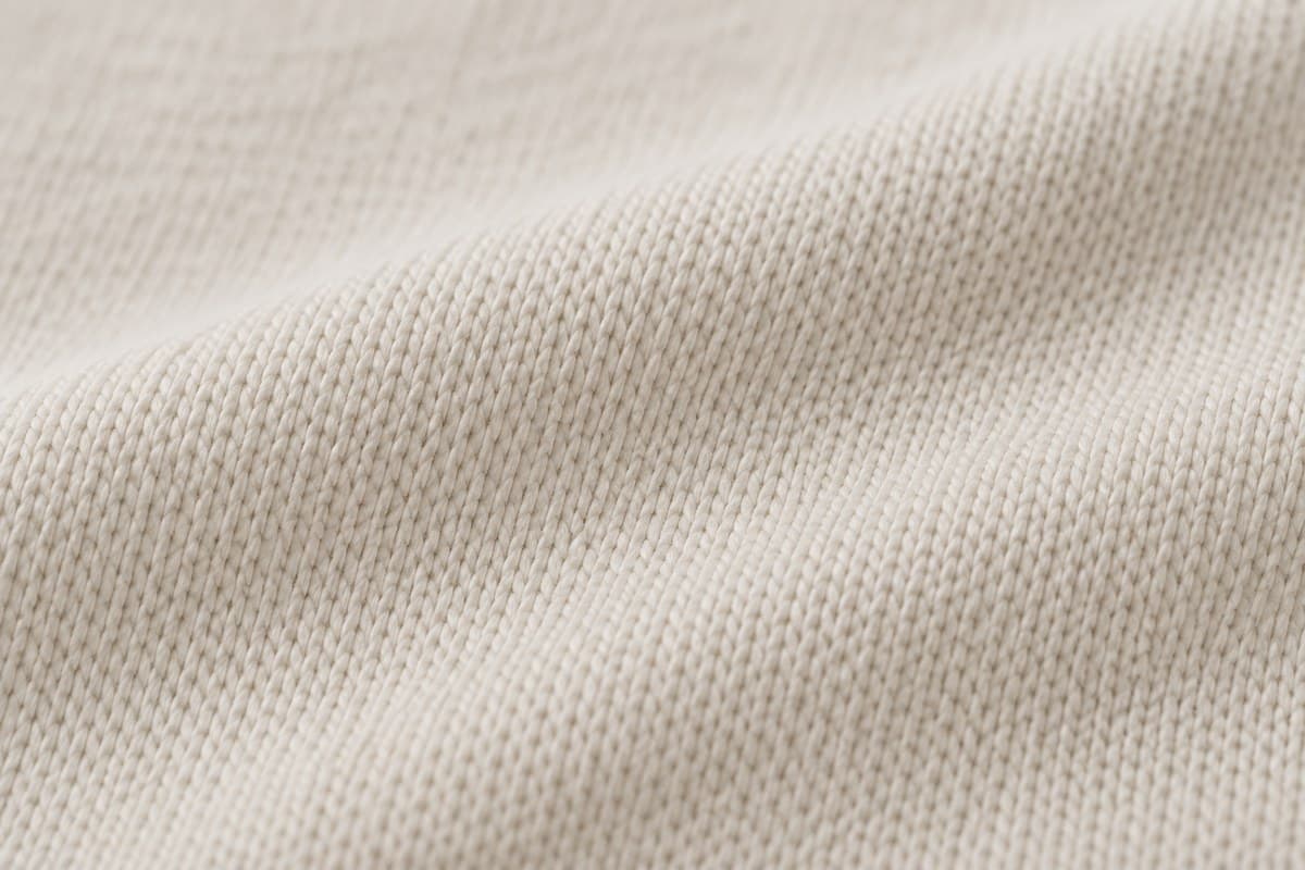 ภาพประกอบผ้า Soft Feel Plus (ผ้าคอตตอน 100%) ซูมใกล้ให้เห็นลายถักของผ้ายืด