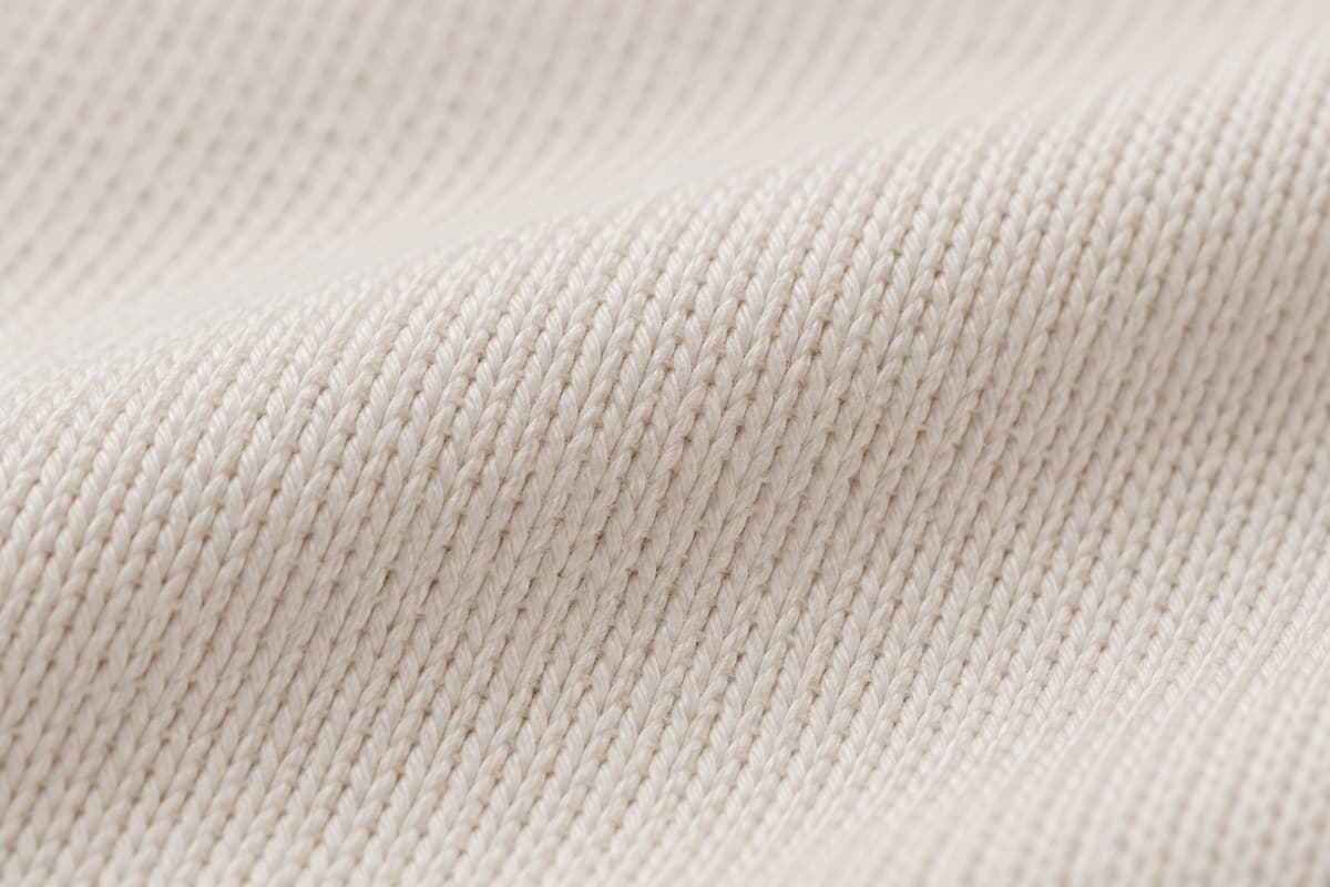 ภาพประกอบผ้า Soft Feel (ผ้าคอตตอน 100%) ซูมใกล้ให้เห็นลายถักของผ้ายืด