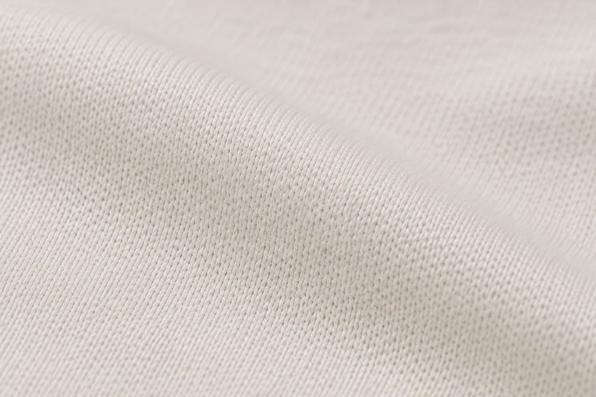 ภาพประกอบผ้า Sport Tech (ผ้าไมโคร / โพลีเอสเตอร์) ซูมใกล้ให้เห็นลายถักของผ้ายืด